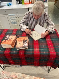 Author Robert MacNain signing books